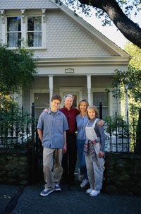 Family in front of house